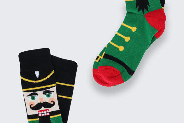 Two pairs of Holiday socks with nutcrackers width=